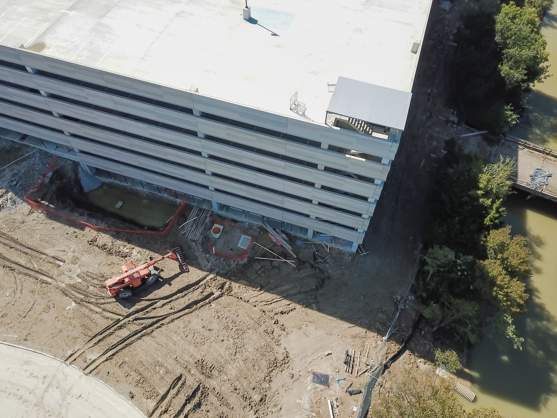 Aerial view machines at multistory garage under construction in Texas, USA