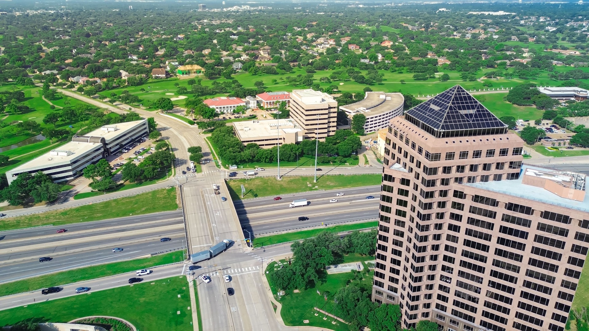Residential houses, golf course, commercial buildings in master development area in Las Colinas, Irving, office space for rent, corporate campus along John Carpenter Freeway, Texas SH 121, aerial